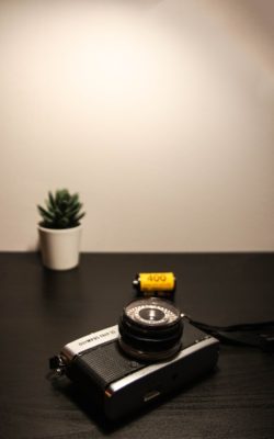 Photo by ROBZ black camera on table